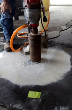 Rebound hammer & coring — Concrete core sampling on site.